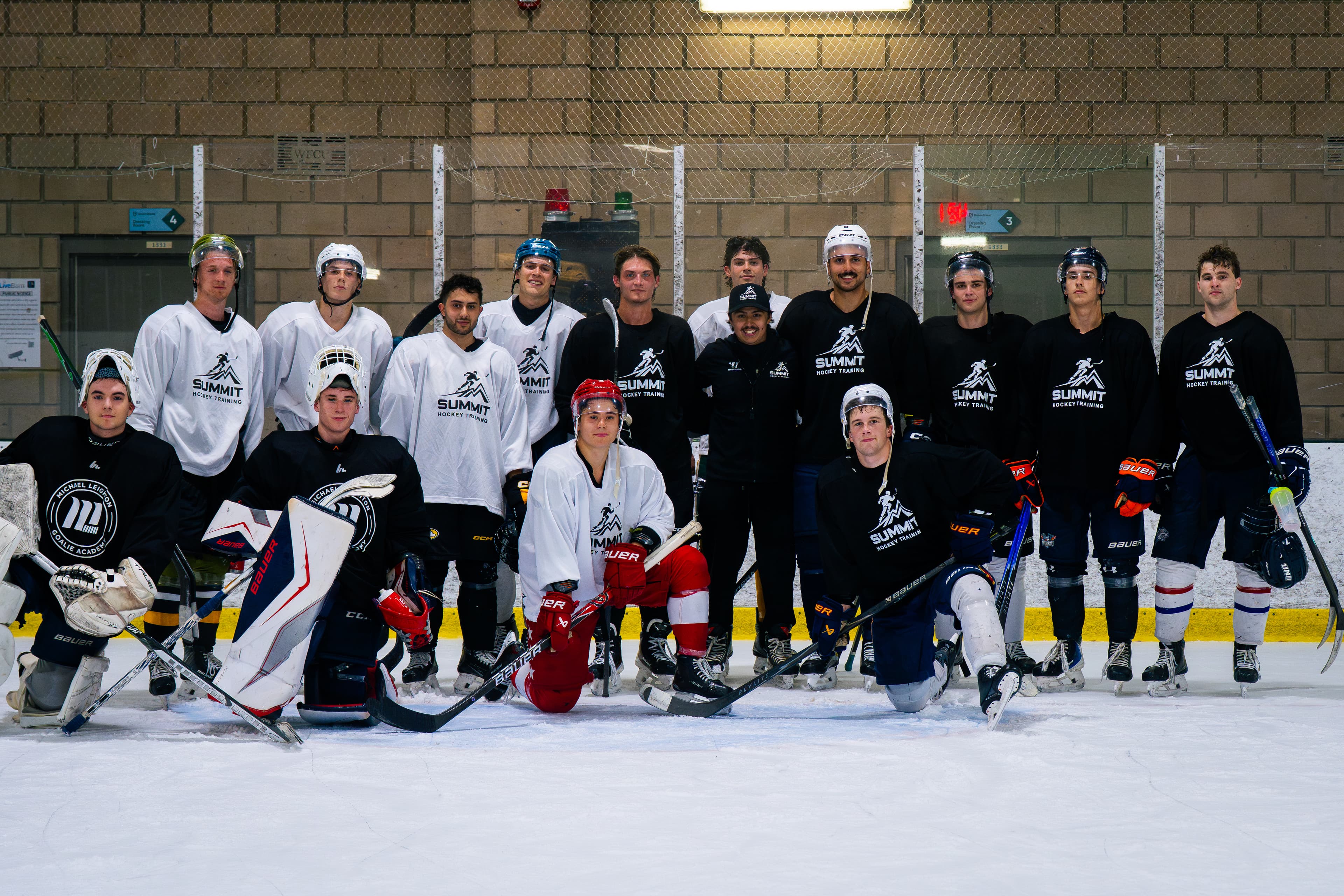 Summit Hockey Training players gathered on the ice